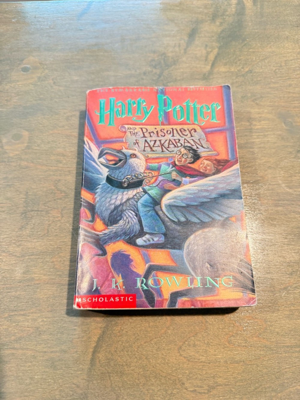 Scholastic Harry Potter paperback — red, orange, purple, blue cover